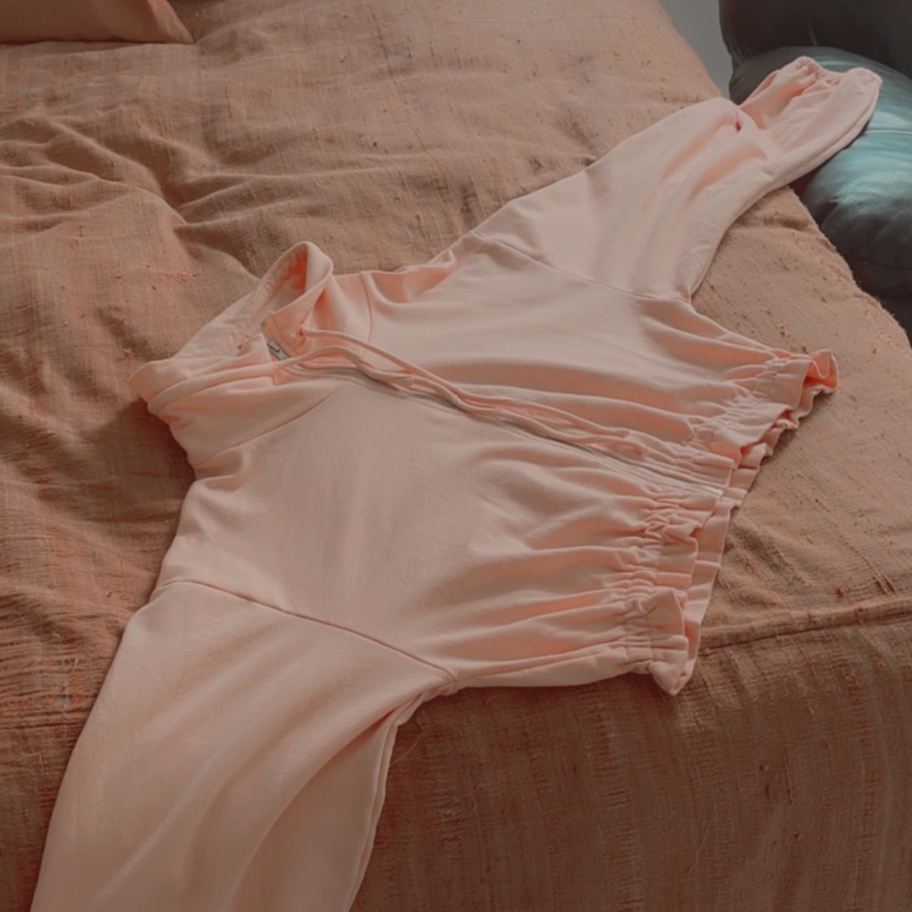 pink long-sleeved jacket crop top